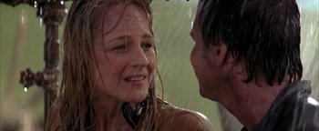 Movie still from “Twister” (1996), directed by Jan de Bont – A man and a woman in the rain; Close Up shot, Over the shoulder angle