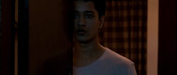 Movie still from “Udaan” (2010), directed by Vikramaditya Motwane – A young man standing in front of a wall; Close Up shot, Low angle