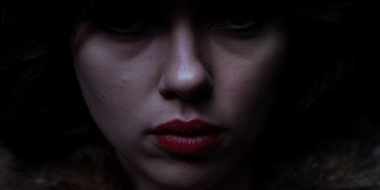 Movie still from “Under the Skin” (2013), directed by Jonathan Glazer – A person with red lipstick on their lips; Extreme Close Up shot, Overhead angle