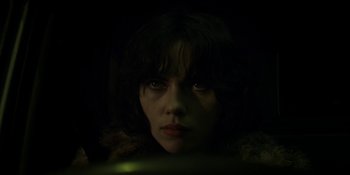 Movie still from “Under the Skin” (2013), directed by Jonathan Glazer – A person wearing a fur coat; Close Up shot, Low angle