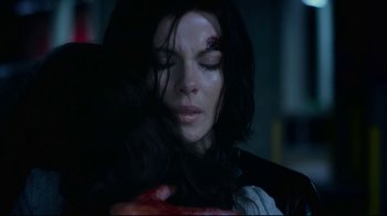 Movie still from “Underworld: Blood Wars” (2016), directed by Anna Foerster – A person with a wound on their face; Close Up shot, Over the shoulder angle