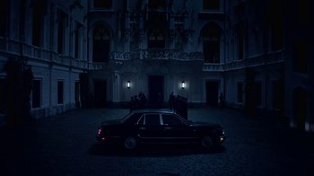Movie still from “Underworld: Blood Wars” (2016), directed by Anna Foerster – A car parked in front of a building at night; Extreme Wide shot, Low angle