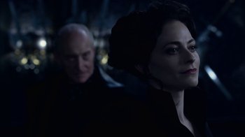Movie still from “Underworld: Blood Wars” (2016), directed by Anna Foerster – A man and a woman in a dimly - lit room; Close Up shot, Over the shoulder angle