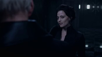 Movie still from “Underworld: Blood Wars” (2016), directed by Anna Foerster – A woman sitting in front of a man in a dark room; Close Up shot, Over the shoulder angle