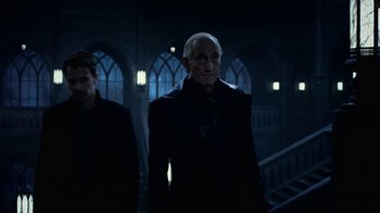 Movie still from “Underworld: Blood Wars” (2016), directed by Anna Foerster – Two people in a dark room with lights on; Medium shot, Low angle