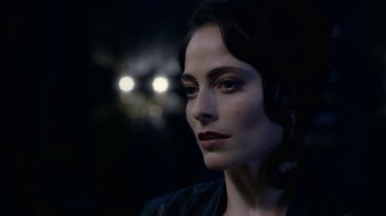 Movie still from “Underworld: Blood Wars” (2016), directed by Anna Foerster – A beautiful woman with dark hair wearing a black jacket; Close Up shot, Over the shoulder angle