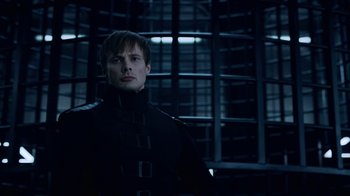 Movie still from “Underworld: Blood Wars” (2016), directed by Anna Foerster – A man in a black jacket standing in front of a window; Medium shot, Low angle