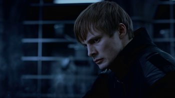 Movie still from “Underworld: Blood Wars” (2016), directed by Anna Foerster – A young man with short blonde hair wearing a black shirt; Close Up shot, Low angle