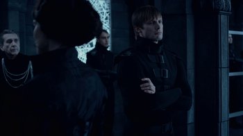 Movie still from “Underworld: Blood Wars” (2016), directed by Anna Foerster – A man in a black suit standing next to another man in a black suit; Medium shot, Over the shoulder angle