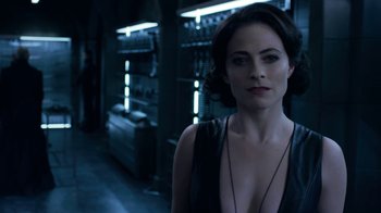 Movie still from “Underworld: Blood Wars” (2016), directed by Anna Foerster – A woman in a black top standing in a room; Close Up shot, Over the shoulder angle