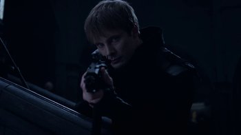 Movie still from “Underworld: Blood Wars” (2016), directed by Anna Foerster – A man holding a gun while standing in a dark room; Close Up shot, Low angle