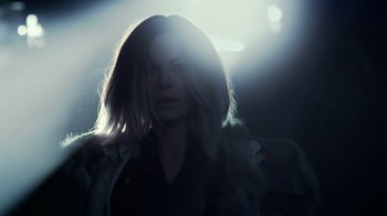 Movie still from “Underworld: Blood Wars” (2016), directed by Anna Foerster – A woman in a black jacket is in the dark; Close Up shot, Over the shoulder angle