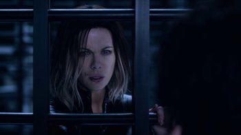Movie still from “Underworld: Blood Wars” (2016), directed by Anna Foerster – A person behind a fence; Close Up shot, Over the shoulder angle