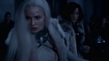 Movie still from “Underworld: Blood Wars” (2016), directed by Anna Foerster – A woman with white hair is standing next to another woman with white hair; Close Up shot, Over the shoulder angle