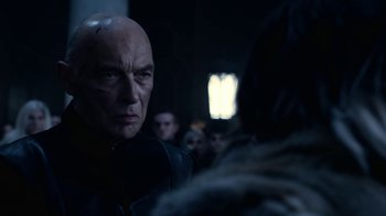 Movie still from “Underworld: Blood Wars” (2016), directed by Anna Foerster – A man in a black jacket is looking at another man in a black jacket; Close Up shot, Over the shoulder angle