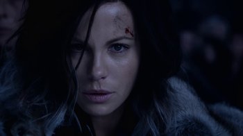 Movie still from “Underworld: Blood Wars” (2016), directed by Anna Foerster – A person with a knife on her face; Close Up shot, Over the shoulder angle