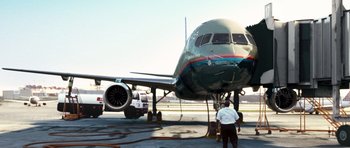 Movie still from “United 93” (2006), directed by Paul Greengrass – An airplane sitting on top of an airport runway; Extreme Wide shot, Low angle