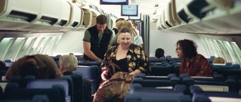 Movie still from “United 93” (2006), directed by Paul Greengrass – A group of people on a united airlines plane; Wide shot, Over the shoulder angle