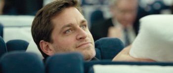 Movie still from “United 93” (2006), directed by Paul Greengrass – A person sitting in a chair; Close Up shot, Over the shoulder angle