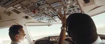 Movie still from “United 93” (2006), directed by Paul Greengrass – A person in the cockpit of an airplane; Medium shot, Low angle