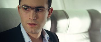 Movie still from “United 93” (2006), directed by Paul Greengrass – A person wearing glasses; Close Up shot, Low angle