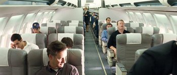 Movie still from “United 93” (2006), directed by Paul Greengrass – A group of people sitting on a plane; Wide shot, High angle
