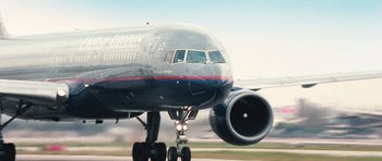 Movie still from “United 93” (2006), directed by Paul Greengrass – A large jet airplane on a run way; Wide shot, Low angle
