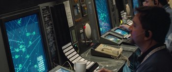 Movie still from “United 93” (2006), directed by Paul Greengrass – A computer desk with a lot of computers on top of it; Medium shot, High angle