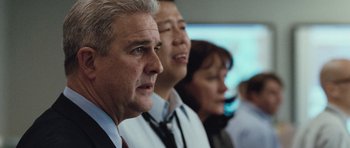 Movie still from “United 93” (2006), directed by Paul Greengrass – A group of people standing next to each other in a room; Close Up shot, Low angle