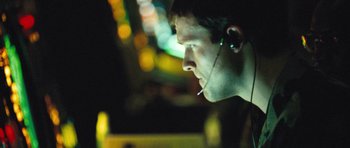 Movie still from “United 93” (2006), directed by Paul Greengrass – A man with a microphone in his ear; Close Up shot, Low angle