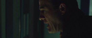 Movie still from “United 93” (2006), directed by Paul Greengrass – A man's face in the dark; Close Up shot, Low angle
