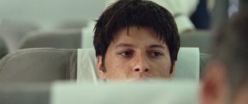 Movie still from “United 93” (2006), directed by Paul Greengrass – A person looking at the camera; Close Up shot, Over the shoulder angle