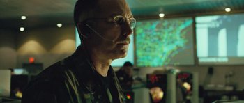Movie still from “United 93” (2006), directed by Paul Greengrass – A man with glasses is looking at a map; Close Up shot, Low angle