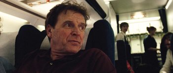 Movie still from “United 93” (2006), directed by Paul Greengrass – A person sitting on a bus; Close Up shot, Low angle