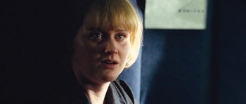 Movie still from “United 93” (2006), directed by Paul Greengrass – A person with short blonde hair; Close Up shot, Over the shoulder angle