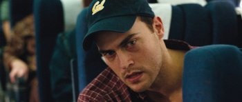 Movie still from “United 93” (2006), directed by Paul Greengrass – A person wearing a hat; Close Up shot, High angle