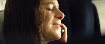 Movie still from “United 93” (2006), directed by Paul Greengrass – A person talking on a cell phone; Extreme Close Up shot, Overhead angle