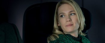 Movie still from “Unknown” (2011), directed by Jaume Collet-Serra – A beautiful blonde woman with a green sweater; Close Up shot, Over the shoulder angle