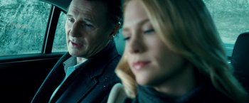 Movie still from “Unknown” (2011), directed by Jaume Collet-Serra – A man and a woman sitting next to each other in a car; Close Up shot, Low angle