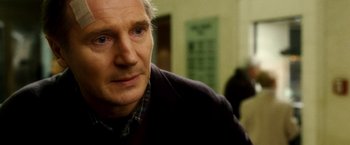 Movie still from “Unknown” (2011), directed by Jaume Collet-Serra – An older man is looking into the distance; Close Up shot, Over the shoulder angle