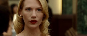 Movie still from “Unknown” (2011), directed by Jaume Collet-Serra – A person with blonde hair; Close Up shot, Over the shoulder angle