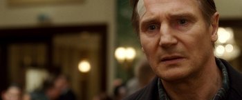 Movie still from “Unknown” (2011), directed by Jaume Collet-Serra – A person with a bandage on his head; Close Up shot, Over the shoulder angle