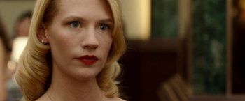 Movie still from “Unknown” (2011), directed by Jaume Collet-Serra – A person with blonde hair; Close Up shot, Over the shoulder angle