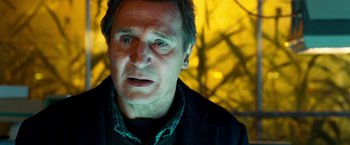 Movie still from “Unknown” (2011), directed by Jaume Collet-Serra – A person wearing a jacket; Close Up shot, Over the shoulder angle