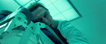 Movie still from “Unknown” (2011), directed by Jaume Collet-Serra – A man in a white shirt and a blue tie; Close Up shot, Overhead angle