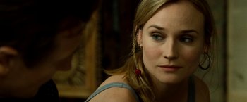 Movie still from “Unknown” (2011), directed by Jaume Collet-Serra – A person wearing a ear cuff; Close Up shot, Over the shoulder angle