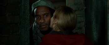 Movie still from “Unknown” (2011), directed by Jaume Collet-Serra – A man and a woman are talking to each other; Close Up shot, Over the shoulder angle