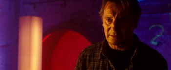 Movie still from “Unknown” (2011), directed by Jaume Collet-Serra – A person wearing a plaid shirt; Close Up shot, Low angle