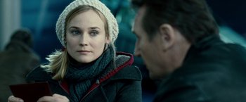 Movie still from “Unknown” (2011), directed by Jaume Collet-Serra – A man and a woman sitting next to each other; Close Up shot, Over the shoulder angle