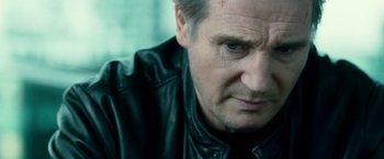 Movie still from “Unknown” (2011), directed by Jaume Collet-Serra – A person wearing a leather jacket; Close Up shot, Over the shoulder angle